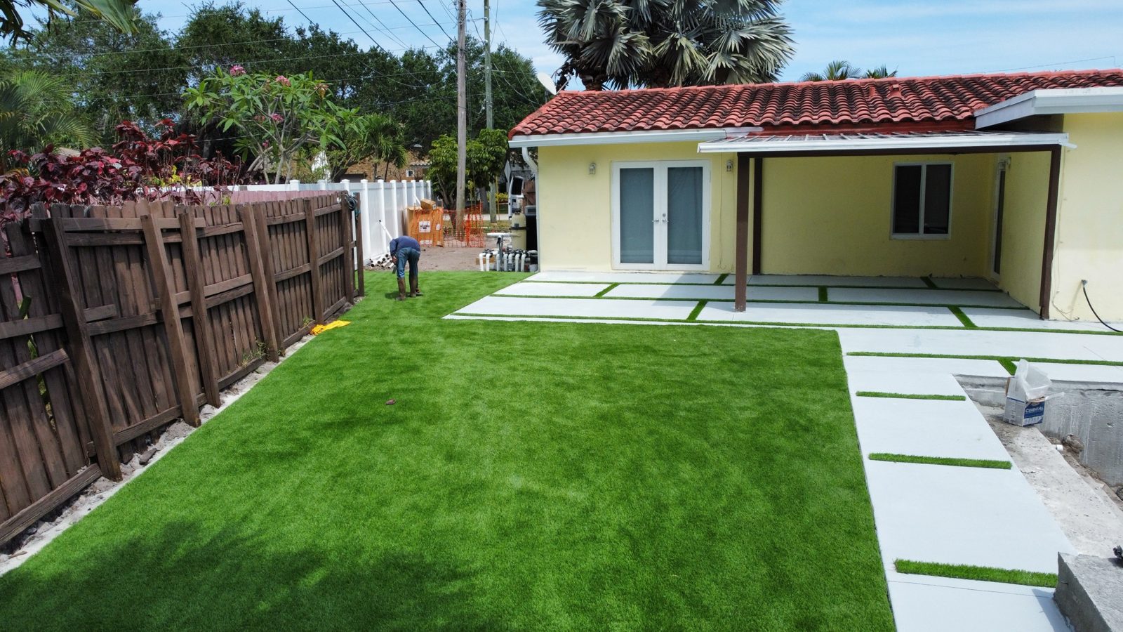 Backyard artificial turf lawn with concrete walkway pads, Broward County, Florida