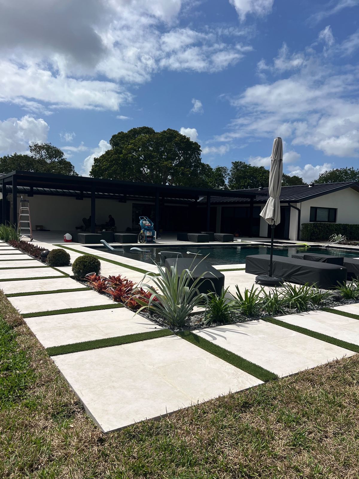 Concrete stepping pads leading to the pool area, Broward County, Florida