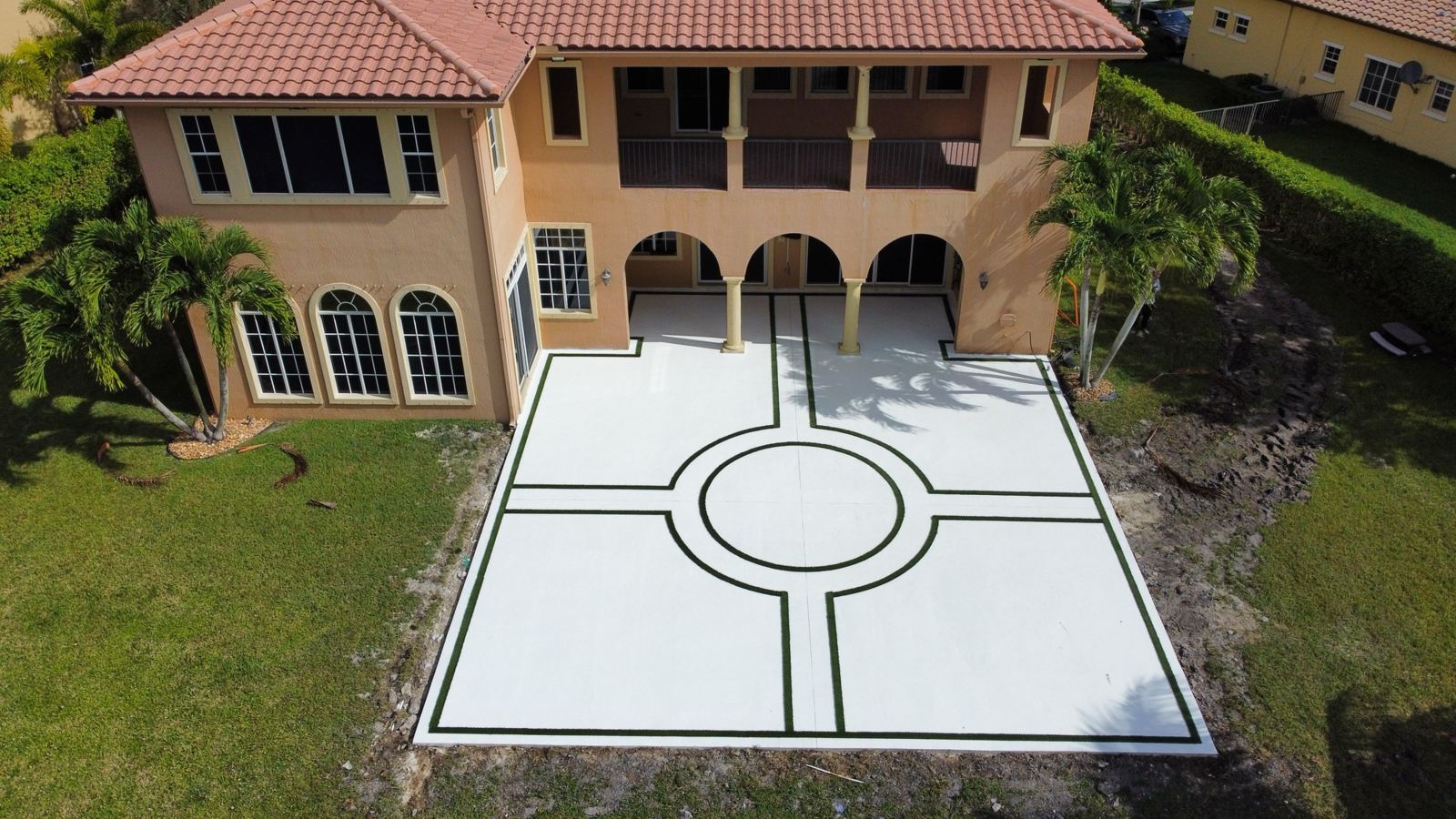 Decorative white concrete motor court by Concrete Solutions Today, serving Lauderdale-by-the-Sea, FL