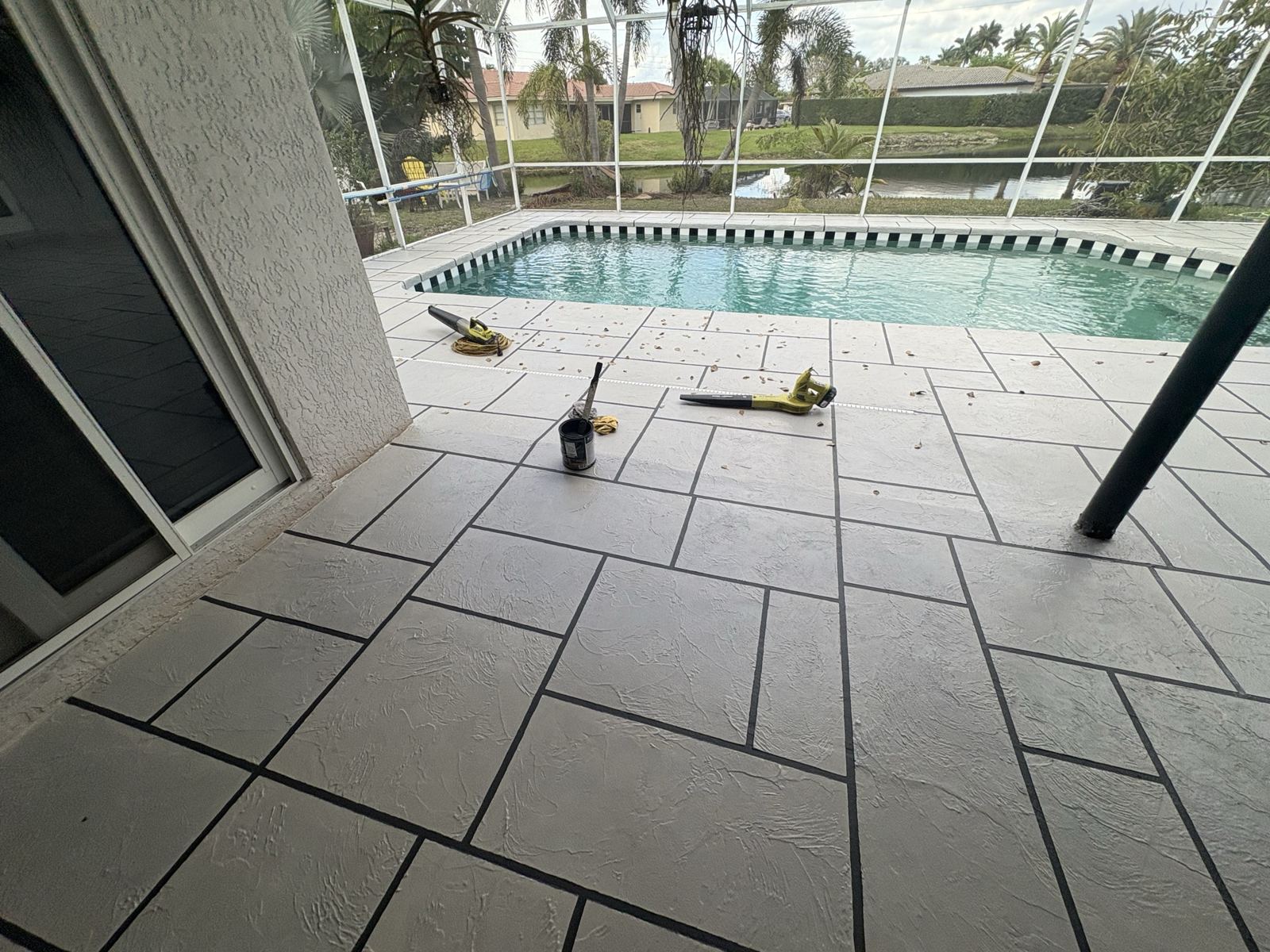 Resurfaced poolside deck with a tile-pattern finish, Broward County, Florida