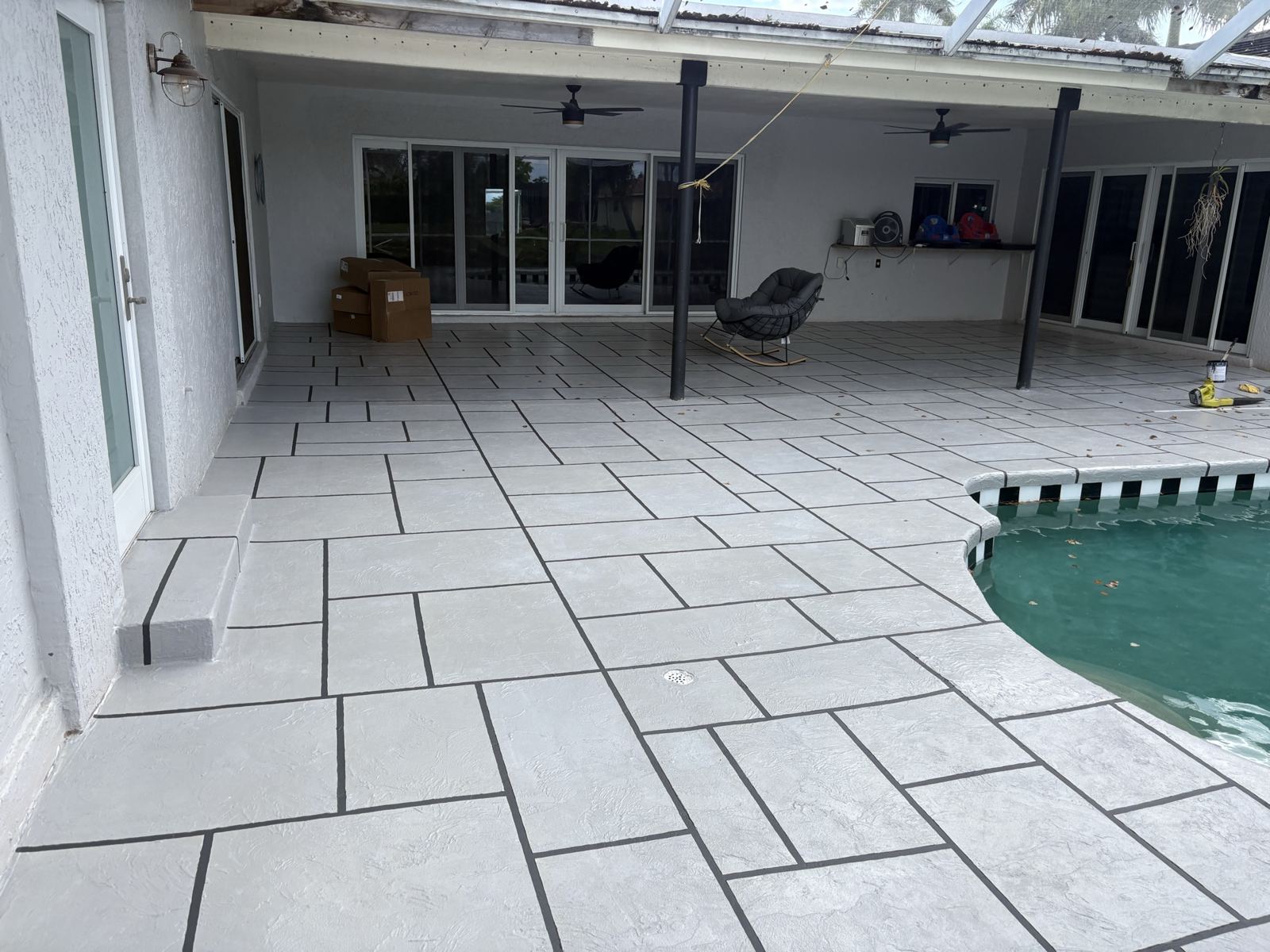Resurfaced covered patio with a tile-pattern finish, Broward County, Florida